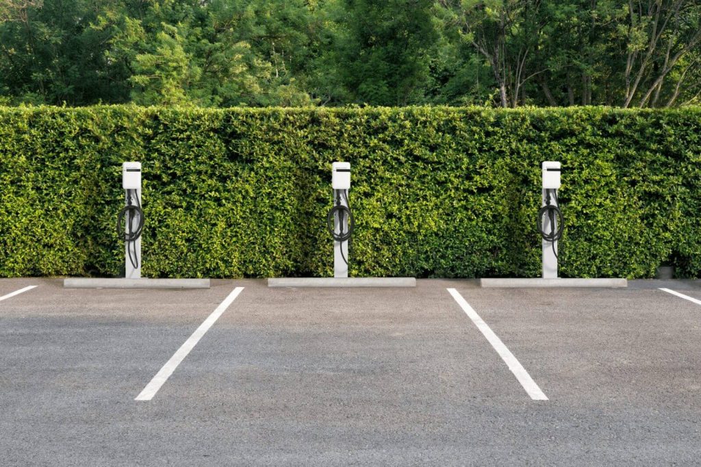 Dedicated 40–60 A circuits (208/240 V) to outdoor-rated Level-2 pedestals with cable management.